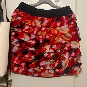 NWT Guess skirt. Red black marbled. Elastic waist band. Zipper. Size Small